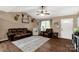 Cozy living room with stylish decor, hardwood floors, and comfortable seating at 522 Kittiewake Ln, Clover, SC 29710