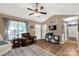 Inviting living room featuring hardwood floors, natural light, and stylish furnishings at 522 Kittiewake Ln, Clover, SC 29710