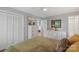 Bright bedroom featuring hardwood floors, neutral walls, and a comfortable queen-size bed at 530 Bonita Dr, Landis, NC 28088