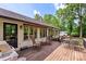 Spacious deck with outdoor seating, rocking chairs, and awning, perfect for relaxing and entertaining at 530 Bonita Dr, Landis, NC 28088