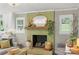 Close-up view of a painted brick fireplace with mantle and elegant decor at 530 Bonita Dr, Landis, NC 28088