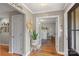 Bright foyer with hardwood floors, decorative plants, and a view into the adjacent living space with french doors at 530 Bonita Dr, Landis, NC 28088