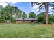 Brick home with a well-manicured lawn and mature trees at 530 Bonita Dr, Landis, NC 28088