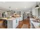 Bright and open kitchen with white cabinetry, granite countertops, and a large island perfect for entertaining at 530 Bonita Dr, Landis, NC 28088