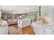 Bright and modern kitchen with a large island, white cabinetry, and open layout leading to a comfortable living space at 530 Bonita Dr, Landis, NC 28088