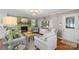 Inviting living room with painted fireplace, lovely decor, and chandelier lighting at 530 Bonita Dr, Landis, NC 28088