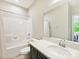 Clean bathroom featuring a vanity with a sink, a large mirror, and a shower/tub combination at 5420 Meadowcroft Way, Fort Mill, SC 29708