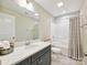 Neutral bathroom features a shower/tub combo with a large mirror and stylish vanity at 5420 Meadowcroft Way, Fort Mill, SC 29708