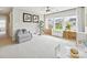 Light-filled bonus room with multiple windows, playroom furniture, and neutral carpeting at 5420 Meadowcroft Way, Fort Mill, SC 29708