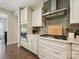 The kitchen features stainless appliances, a gas cooktop, custom cabinets, and subway tile backsplash at 5420 Meadowcroft Way, Fort Mill, SC 29708
