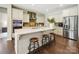 Modern kitchen featuring an island with seating, stainless steel appliances, and plenty of cabinet space at 5420 Meadowcroft Way, Fort Mill, SC 29708