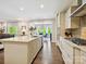 Bright kitchen showcasing a large island, stainless steel appliances, and an open view to the dining area at 5420 Meadowcroft Way, Fort Mill, SC 29708