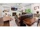 Comfortable living room with a fireplace, built-in shelving, and ample seating at 5420 Meadowcroft Way, Fort Mill, SC 29708