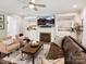 Cozy living room with a fireplace, custom built-ins, and comfortable seating arrangements at 5420 Meadowcroft Way, Fort Mill, SC 29708
