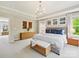 Main bedroom with lots of natural light, contemporary art, a ceiling fan, and neutral carpeting at 5420 Meadowcroft Way, Fort Mill, SC 29708
