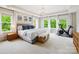A spacious main bedroom offers lots of natural light, tray ceilings, and a dedicated workout area at 5420 Meadowcroft Way, Fort Mill, SC 29708