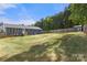 The generous backyard features a lush lawn, providing space for outdoor activities and entertainment, as well as fencing at 5528 Little Mountain Rd, Gastonia, NC 28056