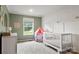 A delightful Bedroom with a modern crib and playful decorations at 5528 Little Mountain Rd, Gastonia, NC 28056