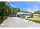 This property features a vast driveway, basketball hoop and an appealing exterior design with spacious outdoor features at 5528 Little Mountain Rd, Gastonia, NC 28056