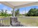 Covered porch with outdoor seating offering scenic neighborhood views at 5528 Little Mountain Rd, Gastonia, NC 28056