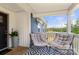 Charming front porch featuring comfortable seating and a welcoming entryway at 5528 Little Mountain Rd, Gastonia, NC 28056