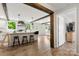 Bright kitchen features a center island with seating and wood beam accents at 5528 Little Mountain Rd, Gastonia, NC 28056