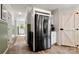Modern kitchen with stainless steel refrigerator and pantry door at 5528 Little Mountain Rd, Gastonia, NC 28056