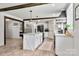 Open kitchen boasts a center island, stainless appliances, and ample cabinet space at 5528 Little Mountain Rd, Gastonia, NC 28056