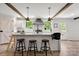 Bright kitchen featuring a center island with barstool seating and stylish pendant lights at 5528 Little Mountain Rd, Gastonia, NC 28056