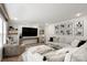 Bright living room with sofa, recessed lights, and large television at 5528 Little Mountain Rd, Gastonia, NC 28056