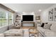 Cozy living room features a large TV, sofa, and ample seating at 5528 Little Mountain Rd, Gastonia, NC 28056