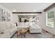 Spacious living room with wood beam, recessed lights, and modern decor at 5528 Little Mountain Rd, Gastonia, NC 28056