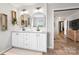 Well appointed main bathroom featuring a dual vanity, wood floors, and decor at 5528 Little Mountain Rd, Gastonia, NC 28056