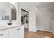 Well appointed main bathroom featuring a single vanity, wood floors, and decor at 5528 Little Mountain Rd, Gastonia, NC 28056