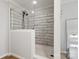 Walk-in shower with attractive white tiling and modern fixtures at 5528 Little Mountain Rd, Gastonia, NC 28056