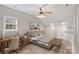 Comfortable bedroom featuring a wooden desk, a neutral color palette, and natural light from the window at 5940 Four Wood Dr, Matthews, NC 28104