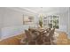Elegant dining room features a chandelier, large window, and seating for six at 5940 Four Wood Dr, Matthews, NC 28104