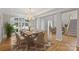 Bright dining room features a chandelier, large window, and open access to the living spaces at 5940 Four Wood Dr, Matthews, NC 28104