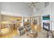 Open concept living area with fireplace, high ceilings, and access to dining and kitchen at 5940 Four Wood Dr, Matthews, NC 28104