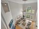 Bright living room with soaring ceilings, large windows, hardwood floors, and comfortable seating arrangement at 5940 Four Wood Dr, Matthews, NC 28104