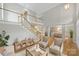 Spacious living room with hardwood floors, staircase, and access to the dining room at 5940 Four Wood Dr, Matthews, NC 28104