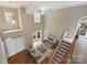 Sun-filled living room boasts high ceilings, hardwood floors, and a view of the staircase at 5940 Four Wood Dr, Matthews, NC 28104