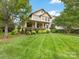 Beautiful home with a welcoming front porch, manicured lawn, and mature trees creating a serene setting at 601 Dorothy Dr, Charlotte, NC 28203
