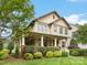 Charming home features a spacious front porch with stylish columns and well-maintained landscaping at 601 Dorothy Dr, Charlotte, NC 28203
