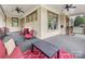 Spacious porch with outdoor seating, ceiling fans, and views of the well-manicured front yard at 601 Dorothy Dr, Charlotte, NC 28203