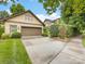 Garage with an expansive driveway and manicured lawn, providing ample parking and curb appeal at 601 Dorothy Dr, Charlotte, NC 28203