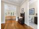 Hallway featuring wooden bench, hardwood floors, and decorative art at 601 Dorothy Dr, Charlotte, NC 28203
