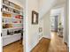 Hallway view leading to a pantry and other rooms, showcasing hardwood floors at 601 Dorothy Dr, Charlotte, NC 28203