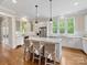 Bright kitchen featuring a large island with granite counters, stainless appliances and hardwood floors at 601 Dorothy Dr, Charlotte, NC 28203