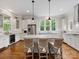 Spacious kitchen with stainless steel appliances, granite countertops, island and three bar stools at 601 Dorothy Dr, Charlotte, NC 28203